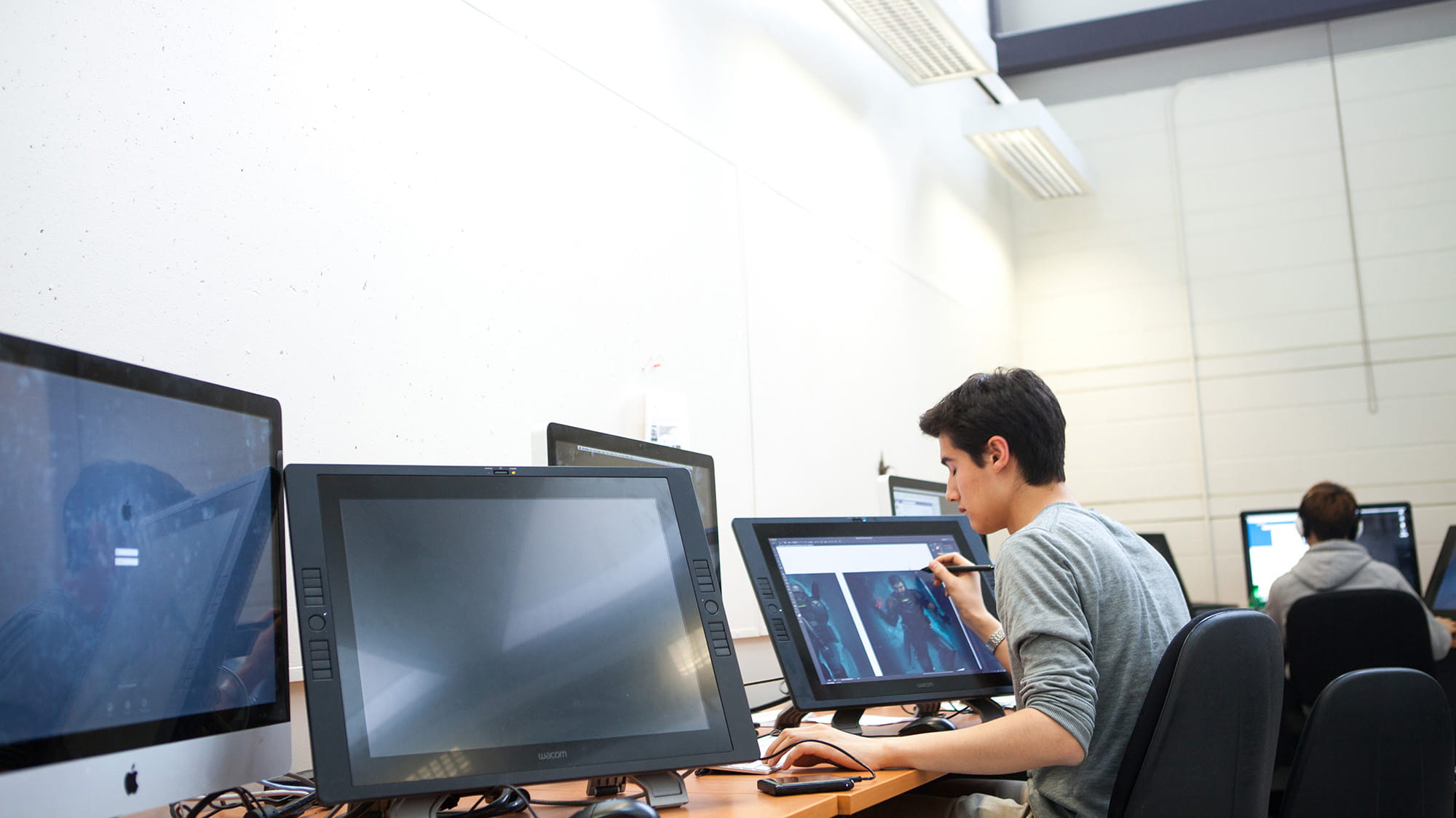 A student working on a computer inside the Animation Lab