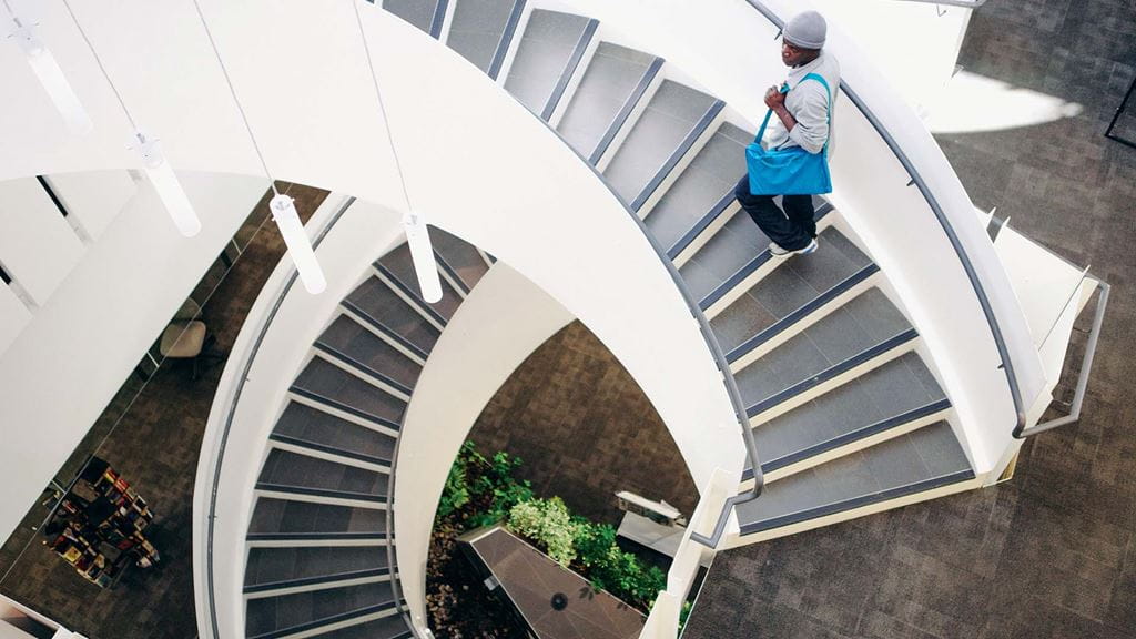Looking down at a spiral staircase in the Library & Learning Commons at Davis Campus