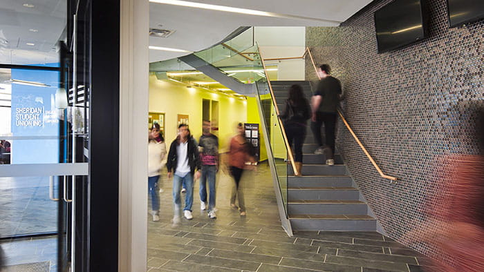 Students walking down the hall at Sheridan's Hazel McCallion Campus