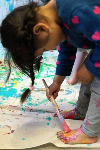 Child painting her foot