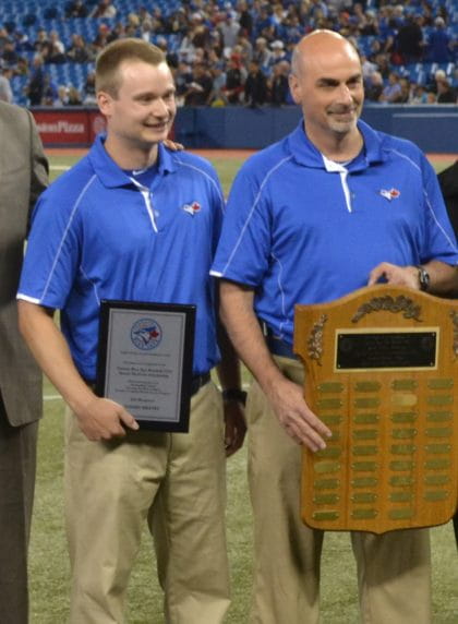 Tommy Kratky with George Poulis receiving an award from the Toronto Blue Jays