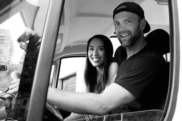 Keith Jones and Vickie Hsieh in the front seat of their van