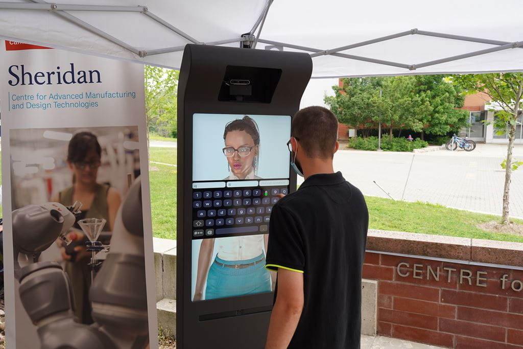 CAMDT student researcher Drew Pitchford interacts with the AVA (Animated Virtual Agent).