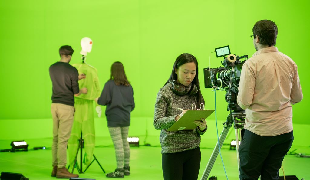 People working in front of a green screen at Sheridan's SIRT