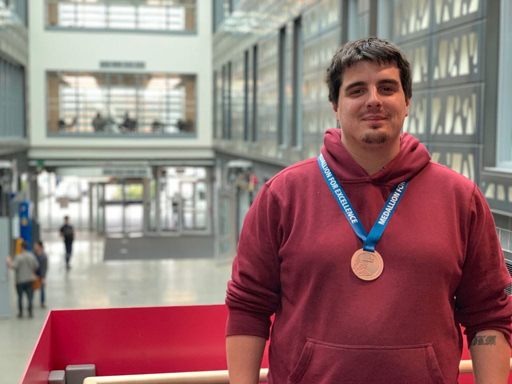 Skilled Trades student Jake Doan wearing his World Skills medallion