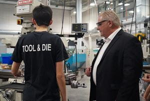 Tool and Die student speaking with Premier Doug Ford